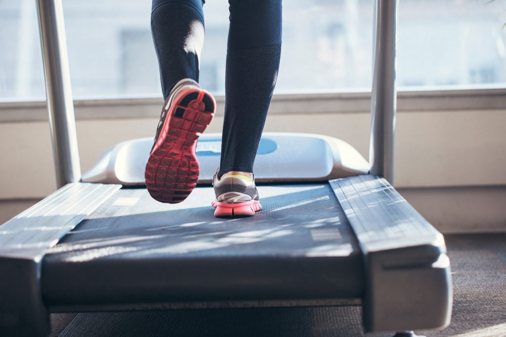 Feet walking on treadmill